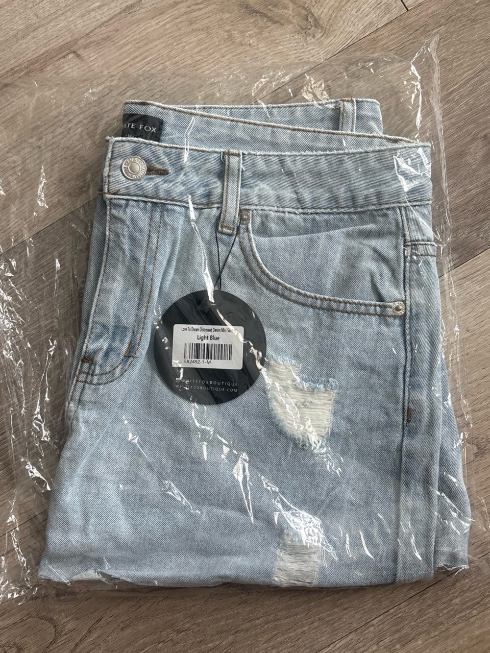 White Fox Boutique Light Blue Distressed Mini Skirt